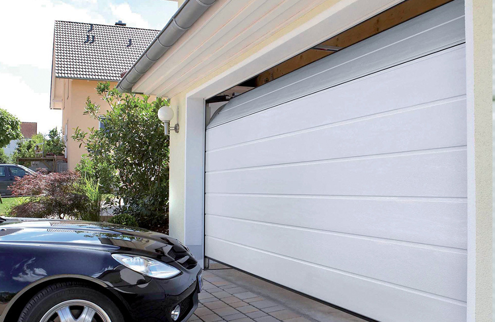 Smartic sectional garage door in a brick facade